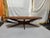Mid century modern coffee table with sculpted base. This has all of the characteristics of an Adrian Pearsall down to the...