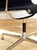 The EA 108 swivel chair by Eames in black hopsack. The Aluminum Group was designed by Eames in 1958. The series is now...