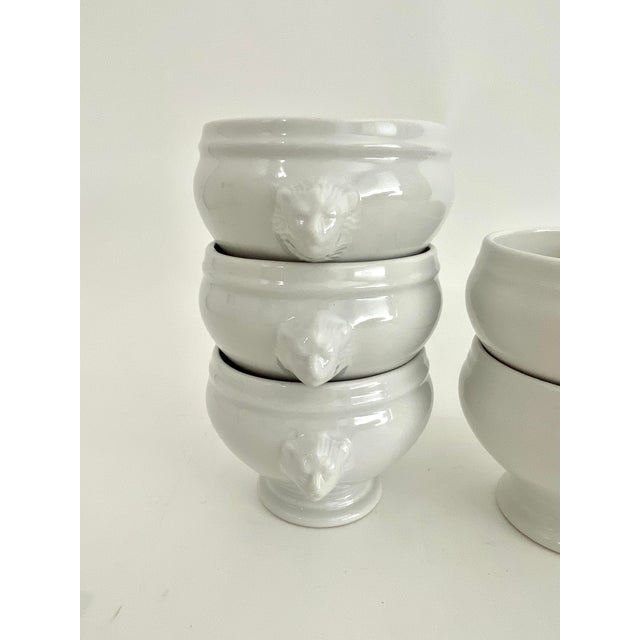 Assorted set of six French lions' head ceramic French onion soup bowls in the traditional shape and figural adornments or...