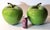 These monumentally large ceramic decorative apples make a whimsical pop art statement in a kitchen or dining room setting....