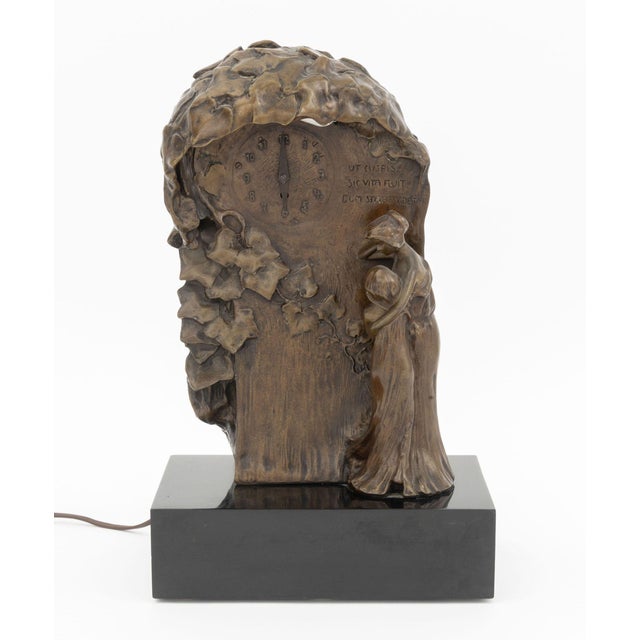 W. Lachner (XIX-XX) Jugendstil Patinated Bronze Mantel Clock, with mother and daughter figures below ivy vines and the...