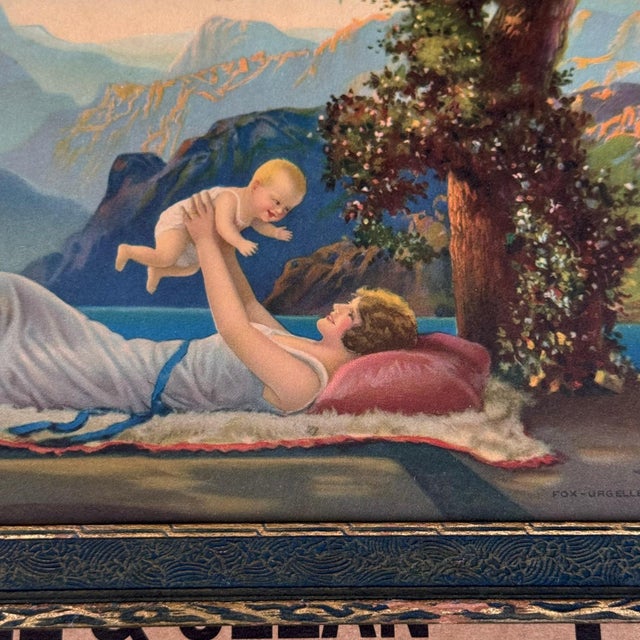 This framed vintage art piece is “Love’s Paradise” (also known as “Mother and Child”), a 1925 color lithograph by beloved...