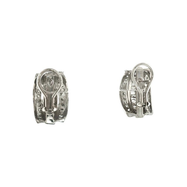 A striking pair of late 20th-century hoop earrings. The earrings feature 44 brilliant-cut white diamonds with an...