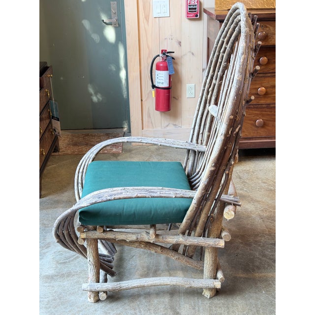 A wonderfully sculptural vintage rustic armchair handcrafted from naturally shaped twig and branch wood. The dramatic...