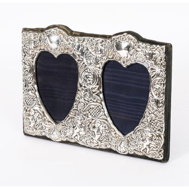 A truly superb decorative Victorian sterling silver twin heart-shaped photo frame with makers mark RBB, and hallmarks for...