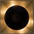 A circle of black metal diffuses the light from this sconceÕs bulb. When lit, the bulb reflects beautifully off of the...