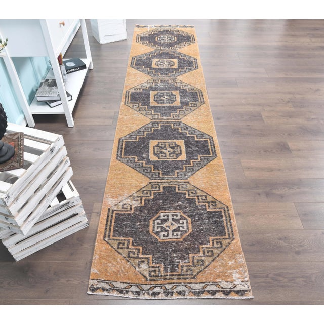 Vintage Turkish Hand-Knotted Herki Runner Rug is a semi-Vintage rug. '60s Eastern region of Turkey's unique rug is...