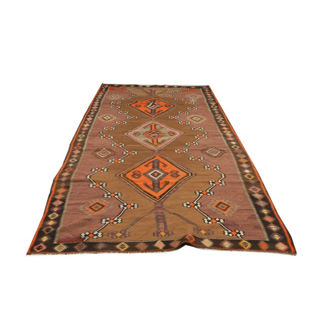 Decorative handwoven vintage kilim rug from Kars region of Turkey. Approximately 50-60 years old. In very good condition.