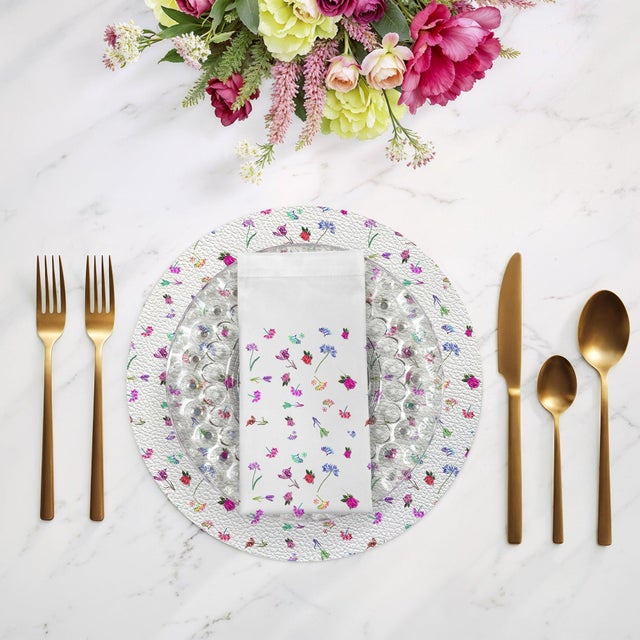 Bring playful floral to your dining table with the Pistils Tossed Cotton Sateen Dinner Napkins, which are both striking in...