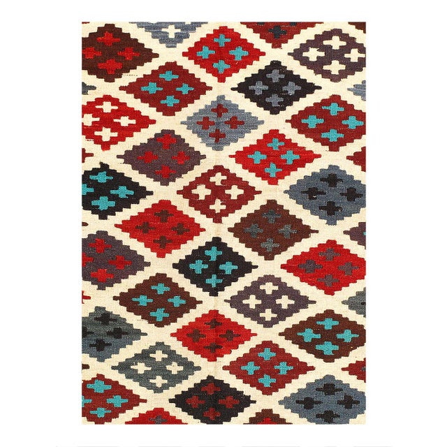 Add a touch of elegance to your home with this casual chic hand woven Kilim wool rug. Constructed on a loom by Nomad...