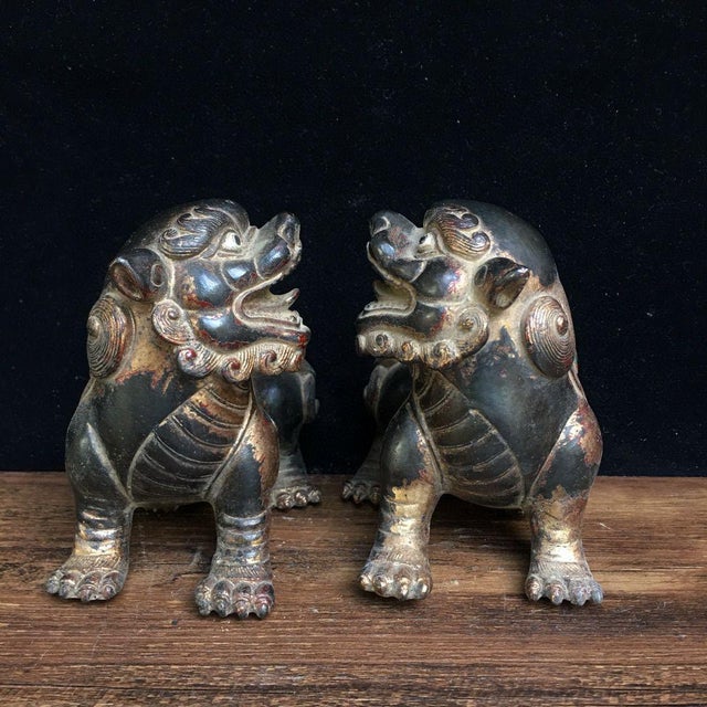 Add a touch of history to your space with this pair of antique guardian lion statues. Crafted from solid bronze, these...