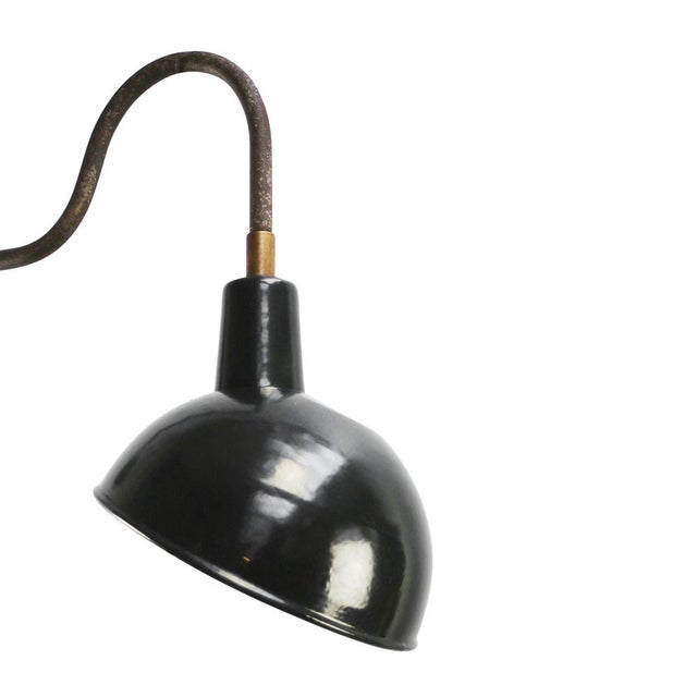 Black enamel industrial wall light with white interior. diameter cast iron wall mount: 10.5 cm / 4” cm, 2 holes to secure....