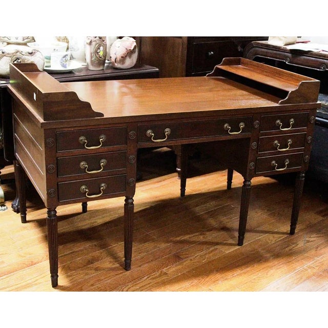 The Large Mahogany 7 Drawer Writing Desk by Kittinger USA is an antique piece from the Regency era, featuring a stunning...
