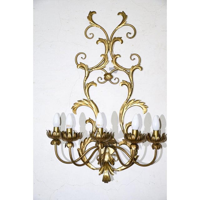 Pair of wrought iron applique lamps decorated in gold with 5 lights available further pair of identical applique lamps...