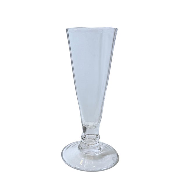Handblown in Vermont, this 7‑inch (18 cm) clear glass vase from Simon Pearce’s Cavendish line has a softly triangular...