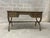 This elegant writing desk, crafted in Holland, Michigan in 1969, features its original finish and brown leather top with...