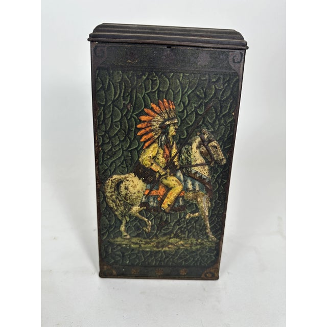 This Antique English confectionary tin was manufactured by Victory-V. It has embossed and lithographed figures on horses...