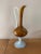 Hot-blown glass pitcher. Amber glass for the body and neck. White opaline glass for the handle and pedestal. Gold trim...