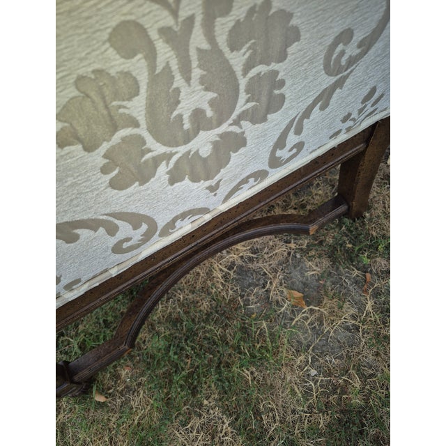 This classic Queen Anne style wingback armchair features an elegant cream and taupe damask or jacquard upholstery pattern,...