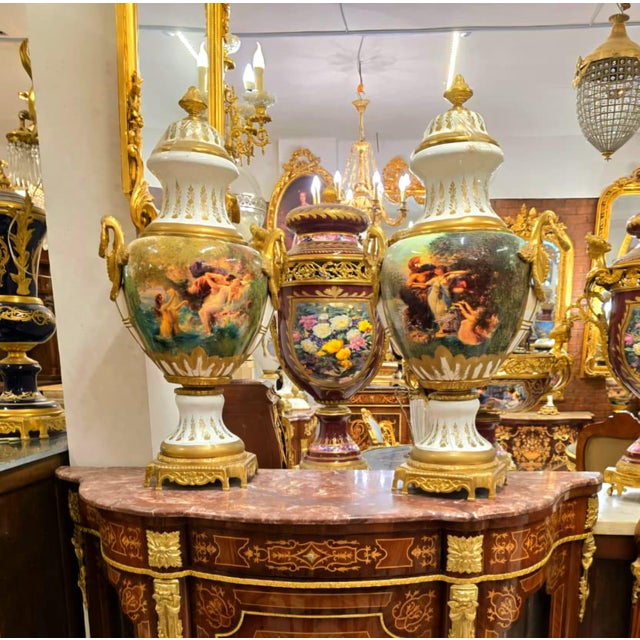 Bring timeless French elegance into your home with this exquisite hand-painted porcelain lidded vase, featuring a graceful...
