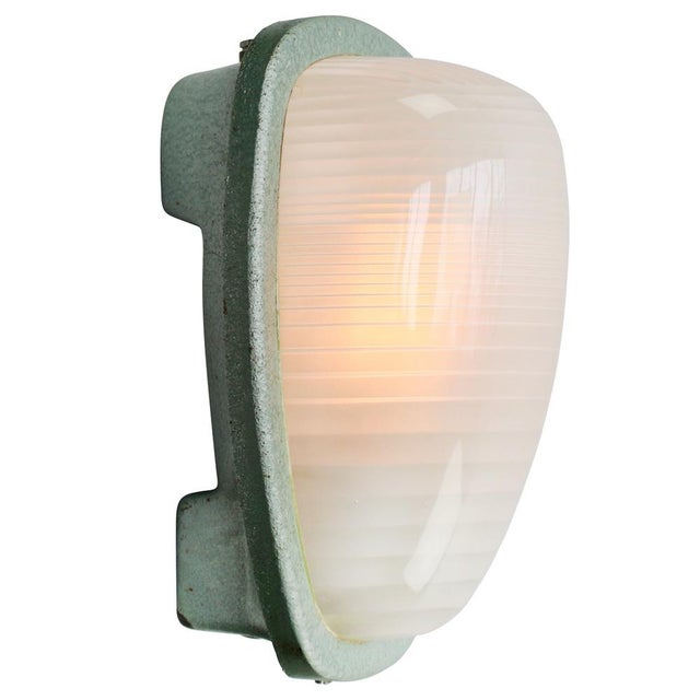 French industrial wall / ceiling lamp by holophane, france, model ae200. Green cast iron with frosted cut glass. e27 / e26...