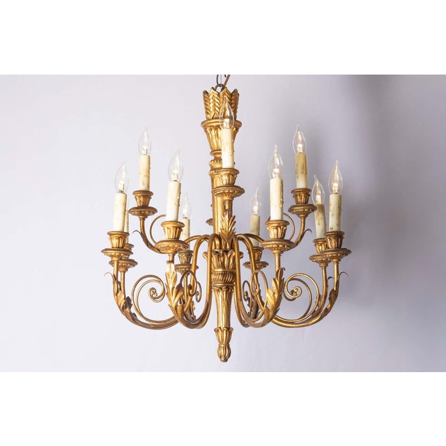 This exquisite 20th-century French chandelier epitomizes the grandeur of Louis XVI-style design, blending neoclassical...