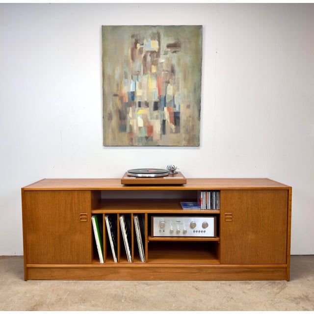 A Danish modern teak bookcase / stereo / media unit with space for multiple components, books CDs and vinyl records by...