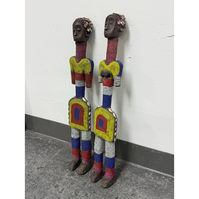 Design Plus Gallery presents a pair of Cameroon Grassfields Bamileke Beaded Standing Figures. Depicting a male and female,...