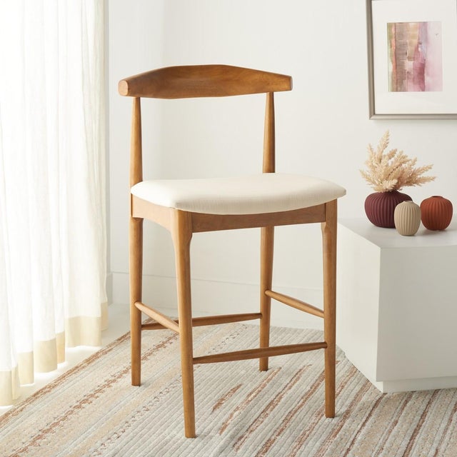 Invite Sleek Style And Elegance To Your Home With Our Lionel Counter Stool. With A Gracefully Curved Bentwood Back, Our...