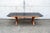 Extendable dining table with two drawers, wooden frame and lacquered wooden top. Nirone model I Bagatti collection...