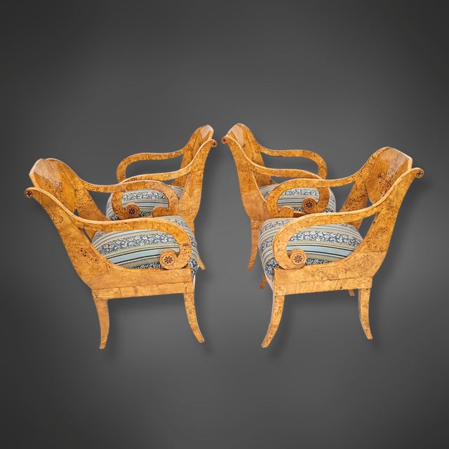 Set of four identical armchairs in curly birch (Karelian birch), circa 1835/40. The backrests are designed as broad,...