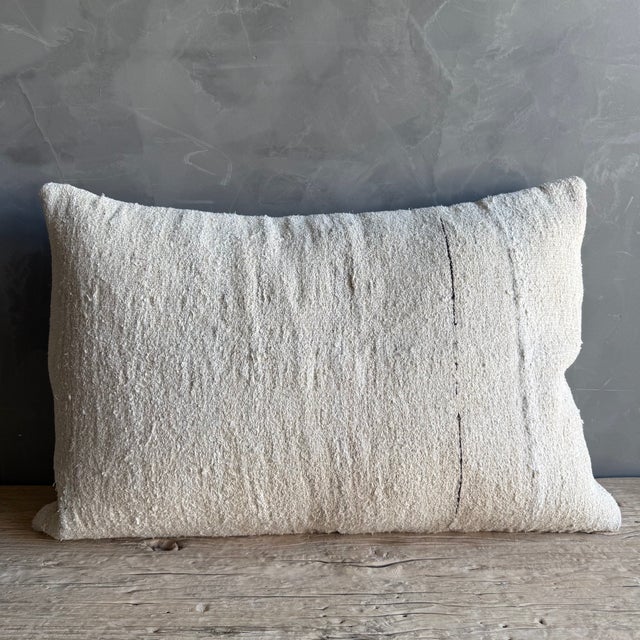 Creamy white hemp rug pillow. Soft hand, linen blend backing with zipper closure. Spot cleaning is recommended, or dry...