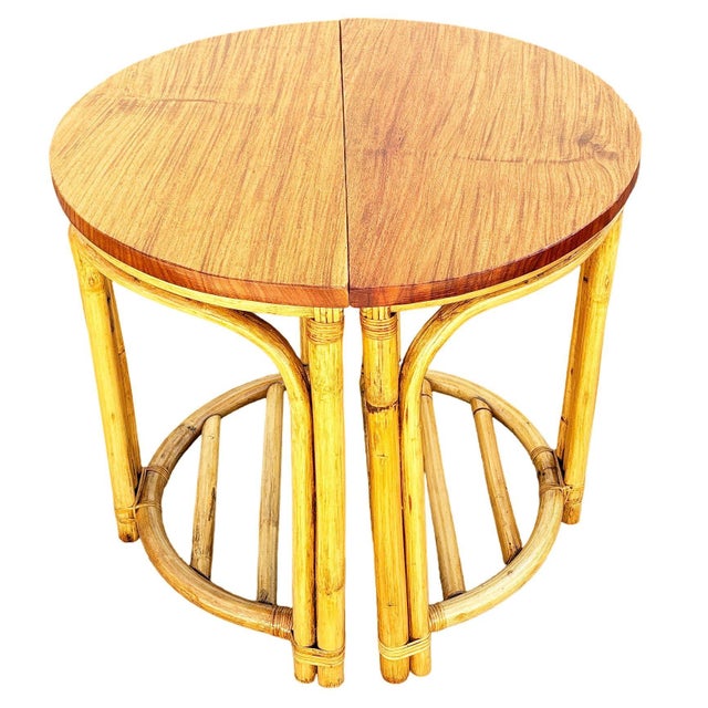 This beautifully restored coastal rattan pair of half-moon side tables offers versatile styling options. They can be...