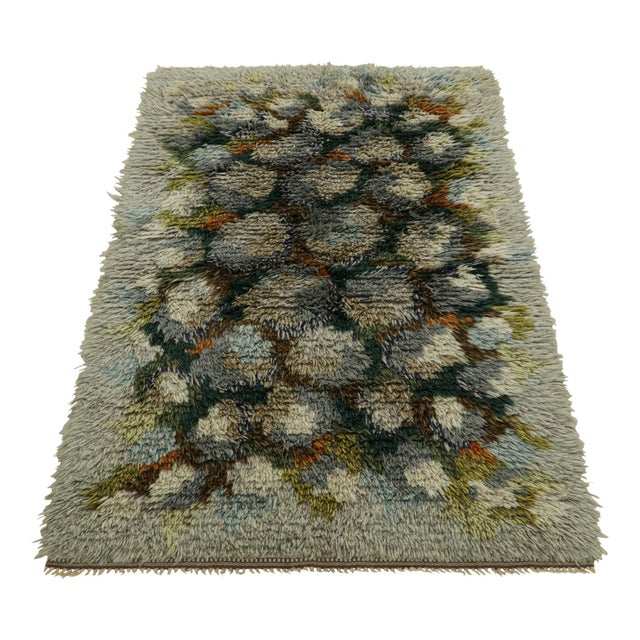 Hand-knotted in lush, high-pile wool in Sweden circa 1960-1970, this 3x5 vintage Swedish Rya rug is a bold new addition to...