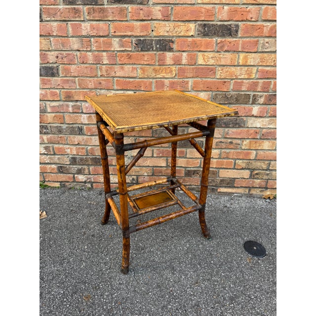 This is a beautiful 19th century English bamboo side table! Tables like these make excellent accent pieces because their...
