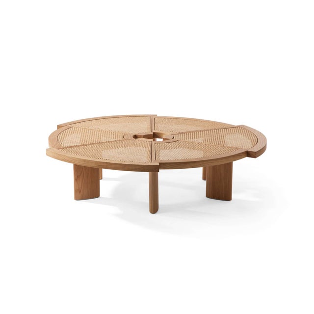 The low table by Charlotte Perriand is composed of six segments of different radius, arranged in a circle but offset from...