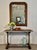 This antique French gilt mirror features a lovely aged patina, with intricate gilt detailing. The original glass is still...