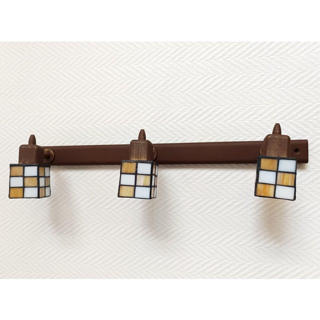 Antique brown metal ceiling light with three swiveling lights and square tiffany-style glass shades, art deco. includes...