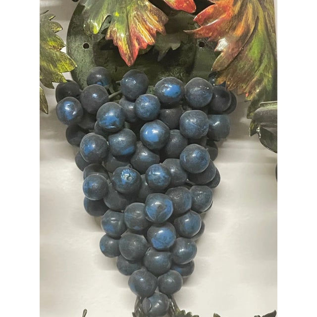 Italian Grape-Shaped Iron and Wood Wall Sconces. The material is a combination of iron and wood. The grapes are also made...