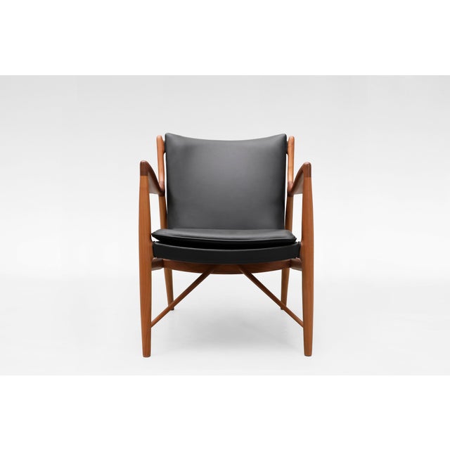 Elegant and sculptural Model 45 armchair by Finn Juhl, designed in the mid-1940s and produced in Denmark. One of Juhl’s...
