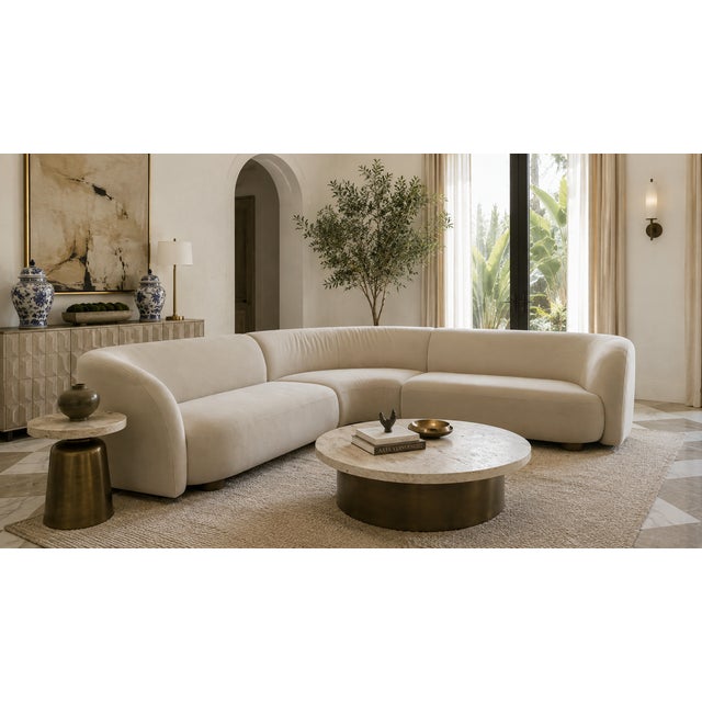 A striking West Elm Laurent three-piece sectional, featuring the collection’s distinctive sculptural silhouette, softly...