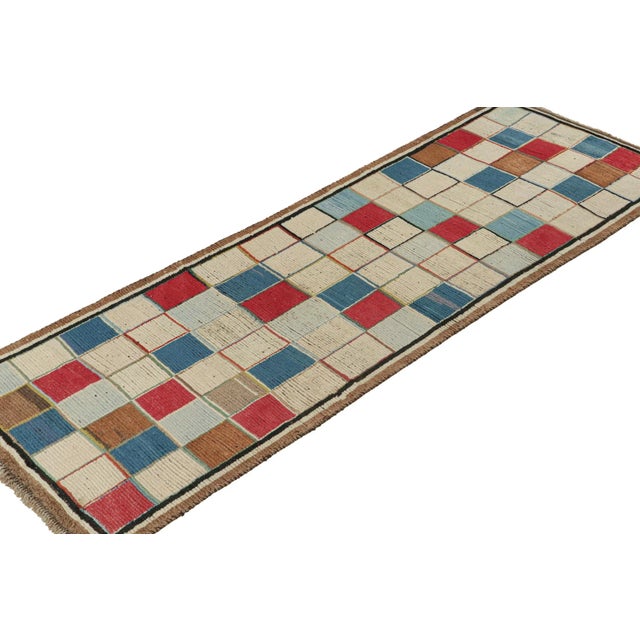 This vintage 3x9 Persian runner is a rare mid-century tribal rug, hand-knotted in wool circa 1950-1960. Its design enjoys...