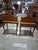 A beautifully matched pair of mid-century French Provincial bedside tables in the Louis XV style. Each piece features a...