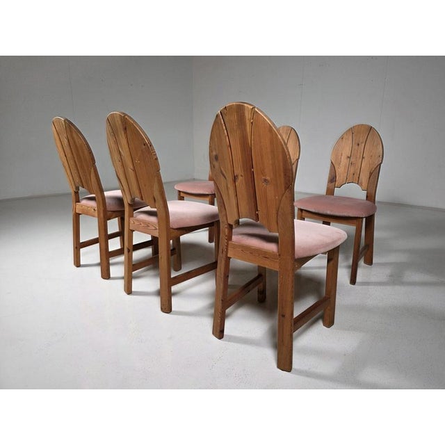 Striking set of six Scandinavian dining chairs, made in Sweden during the 1970s. Crafted from solid pine, the chairs are...