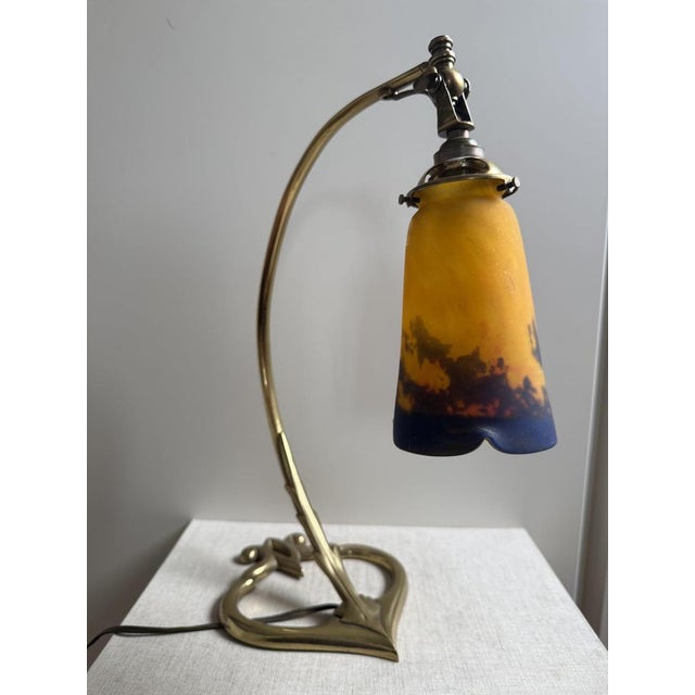 An elegant and highly decorative French Art Deco desk lamp by Muller Frères Lunéville, France, dating to the 1920s. The...