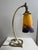 An elegant and highly decorative French Art Deco desk lamp by Muller Frères Lunéville, France, dating to the 1920s. The...