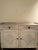 Gustavian painted sideboard with gallery top, canted front, fluting top drawers, lower paneled drawers, applied reeded...