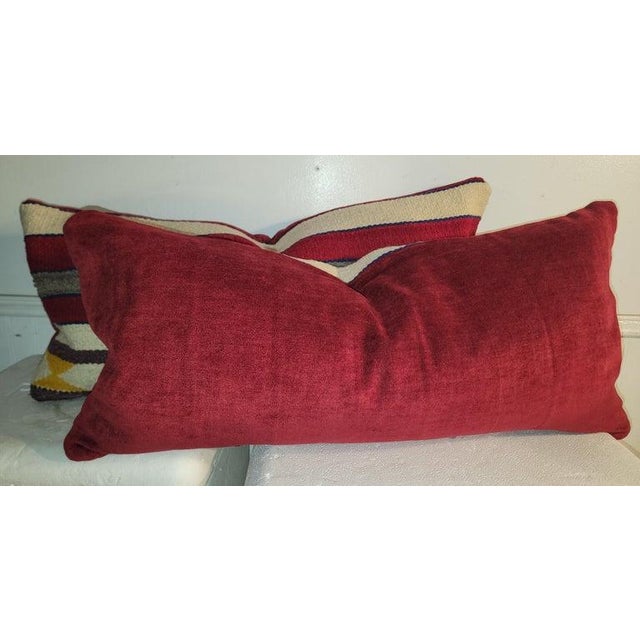 Hand made wool; striped weaving pillows. Tightly woven with beautiful color pallet. Backing is mad from a beautiful red...
