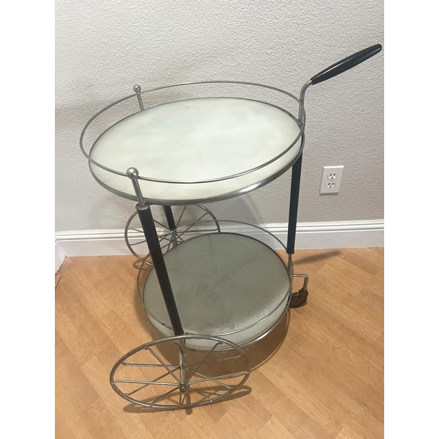 This stylish Bar Tea Cart is designed similar to Milo Baughman from the Design Institute of America designed. Metal frame...