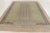 This contemporary 9x12 Art Deco rug, hand-knotted in wool, explores geometric form through fine linear striping and a bold...